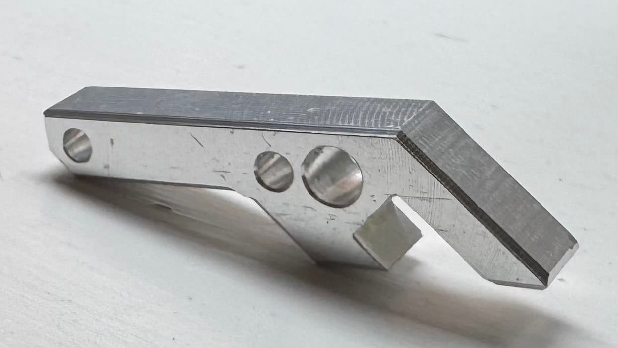 Finished machined geometric bottle opener