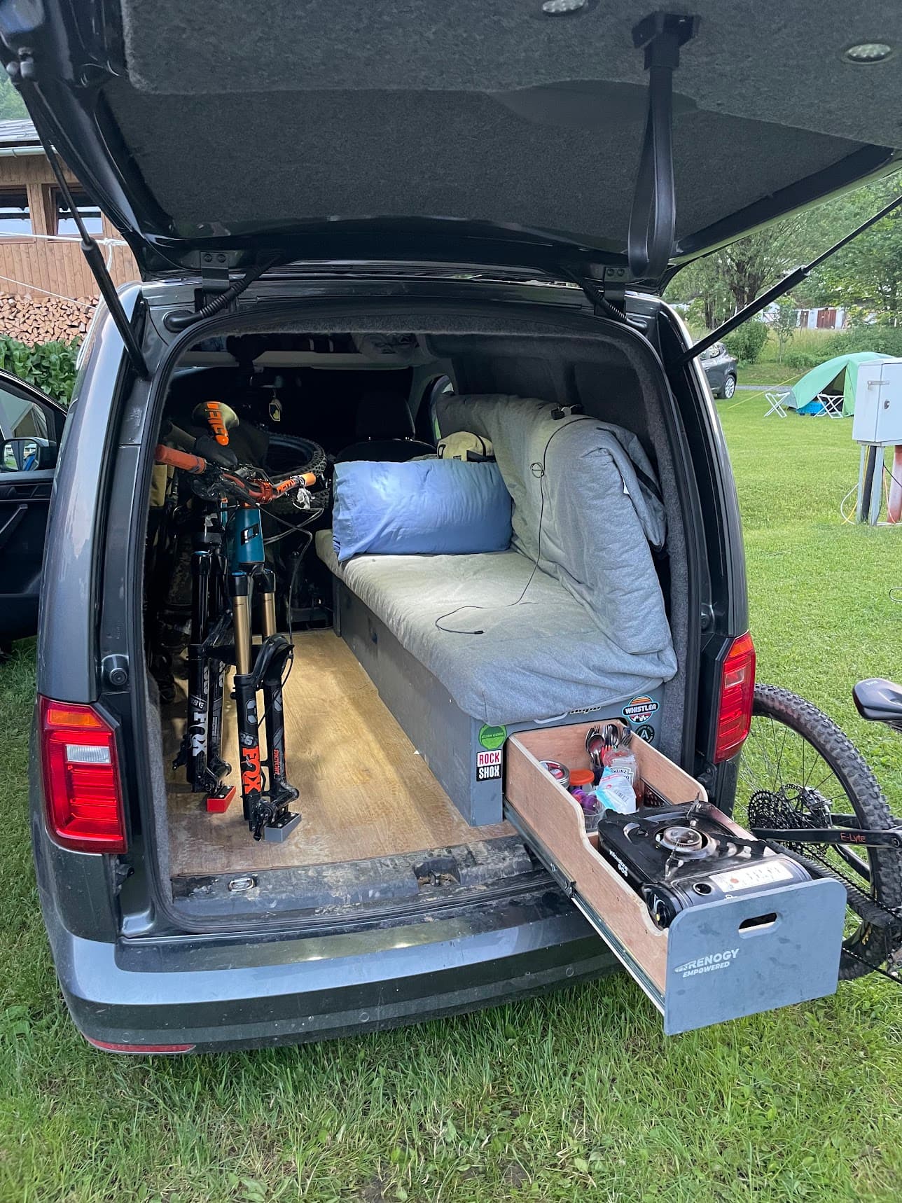 VW Caddy camper conversion showing the finished compact interior