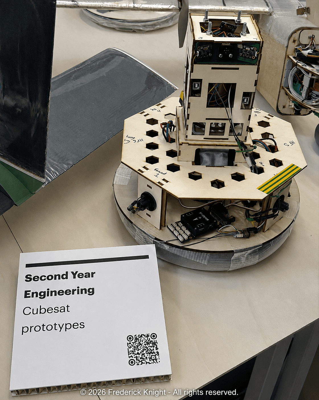 Completed CubeSat and low-friction platform assembly